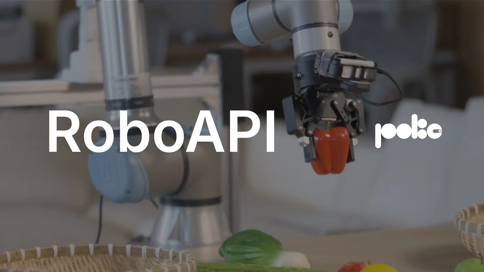 RoboAPI launch film cover: a robotic arm holding a red pepper